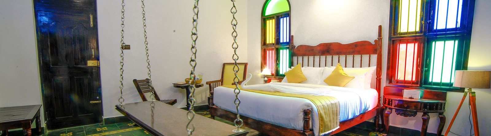Image of a room with a bed and a window on the side at WOW Bison Woods.